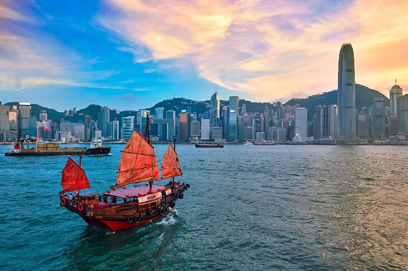 boat-with-hong-kong-skyline-background