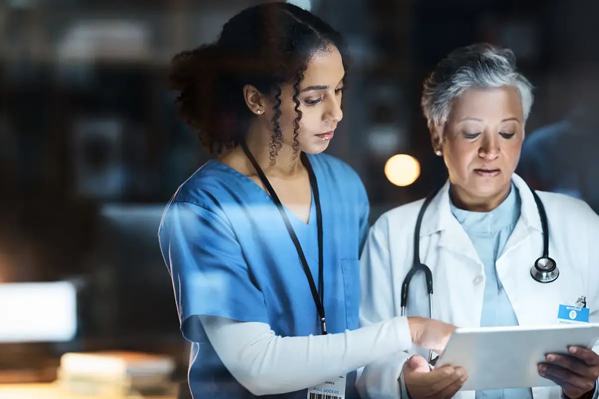 healthcare professionals talking over health insurance