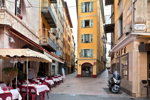 yellow building on a narrow french street 