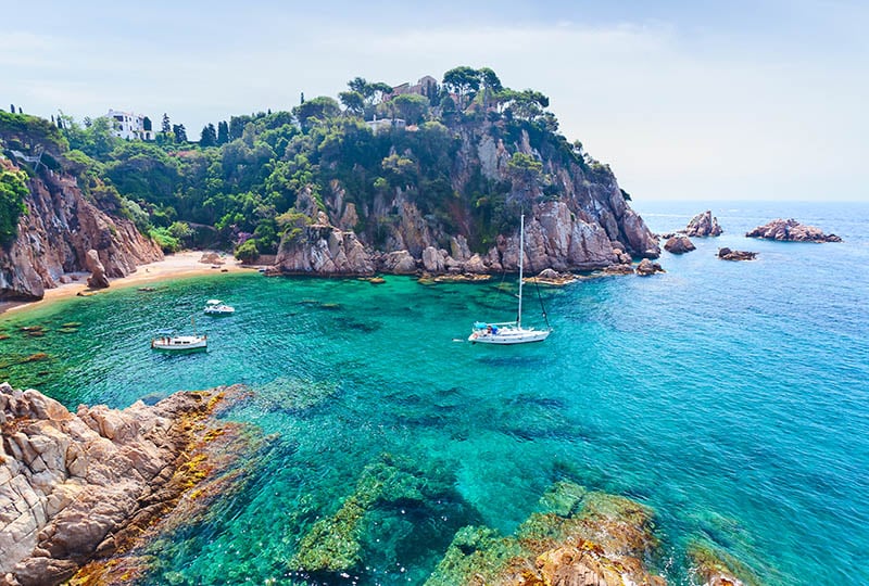 yacht sailing on spanish coastline